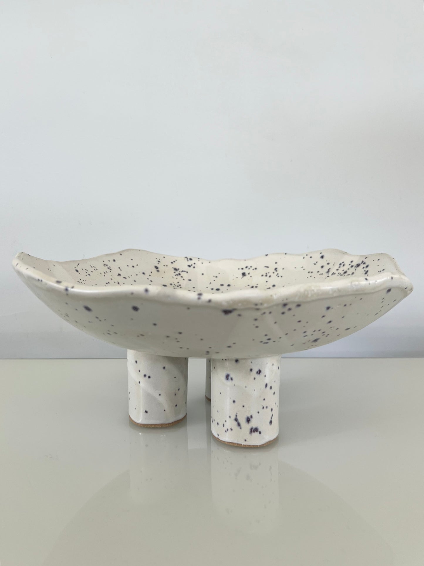 Three-Legged Pillar Pedestal Fruit Bowl - Matte White with Indigo Specks