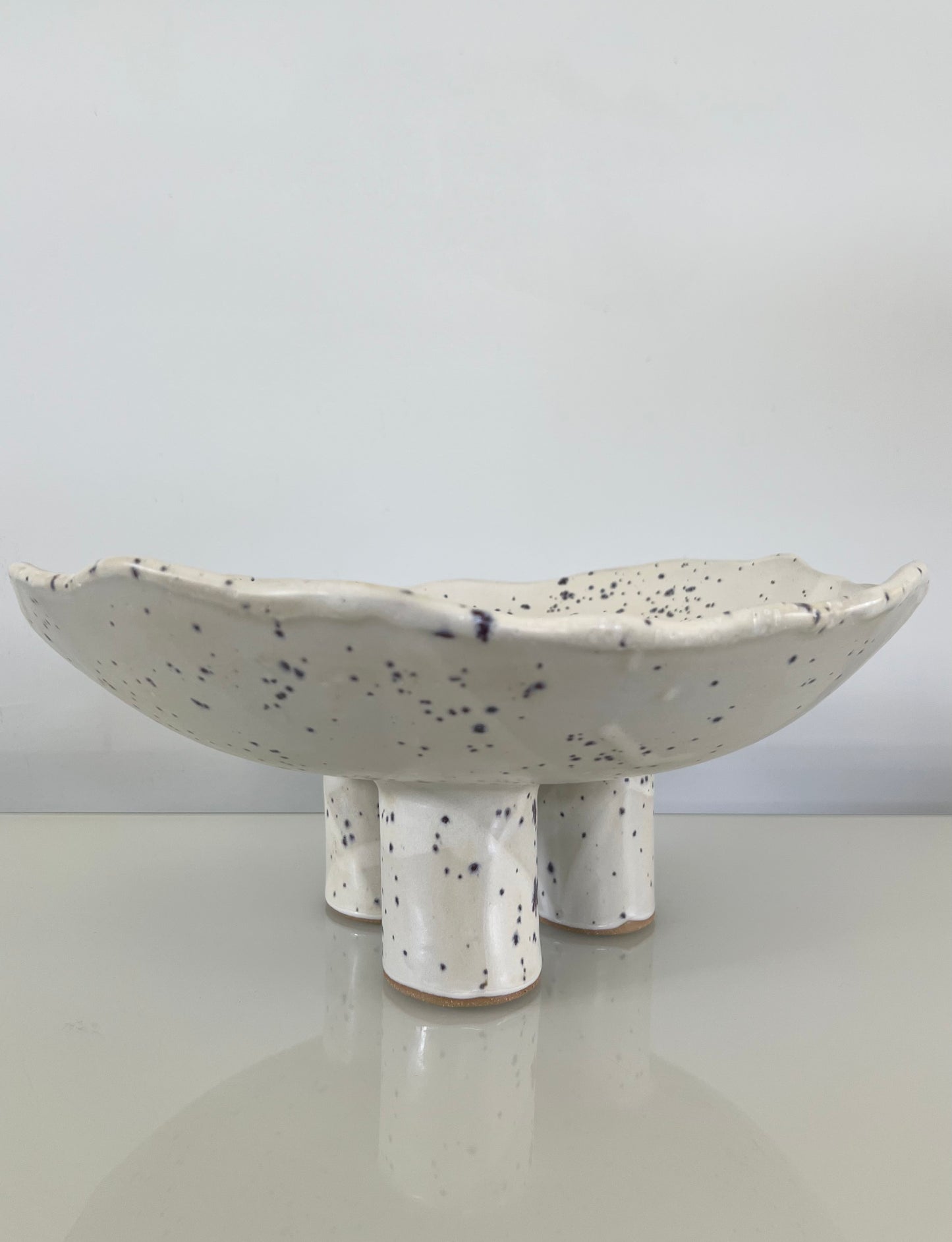Three-Legged Pillar Pedestal Fruit Bowl - Matte White with Indigo Specks